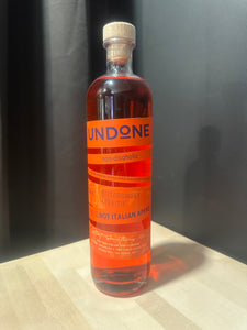 Bottle of Undone - Not Italian Apero on a dark surface